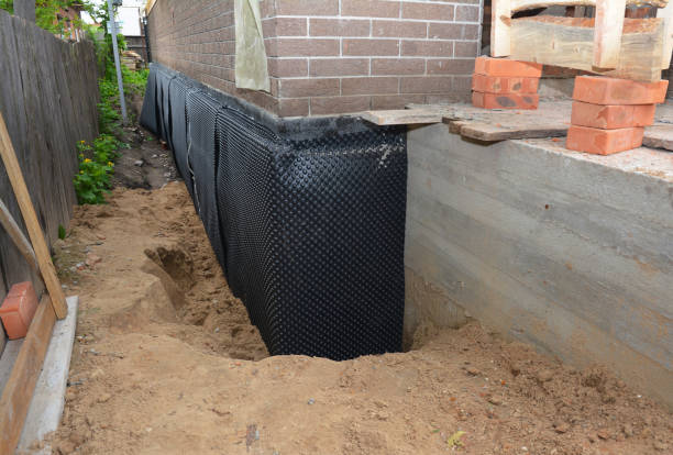 Happy homeowners after waterproofing job in Plymouth Meeting